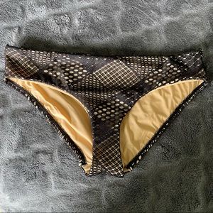 A. Che black netted over shimmery gold bikini bottom